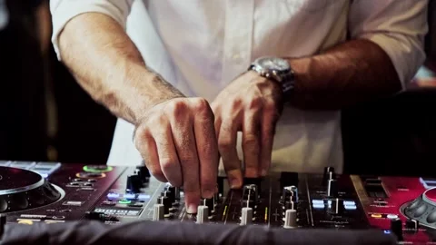 Close up DJ plays live set and mixing music on turntable console. Stock Footage 294467850