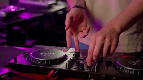 Close up DJ using controller console to mix music list in club Stock Footage 201487972