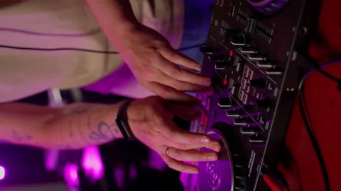 Close up DJ using controller console to mix music list in club Stock Footage 201488652