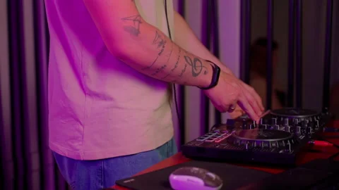 Close up DJ using controller console to mix music list in club Stock Footage 201496186