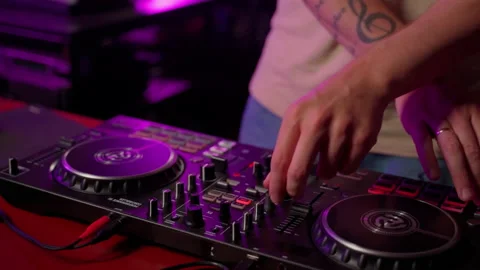 Close up DJ using controller console to mix music list in club Stock Footage 201497218