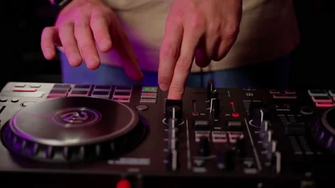 Close up DJ using controller console to mix music list in club Stock Footage 201497292
