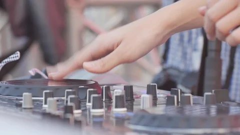 Close up DJ works on the DJ console, adds volume levels. Video stock 94219688