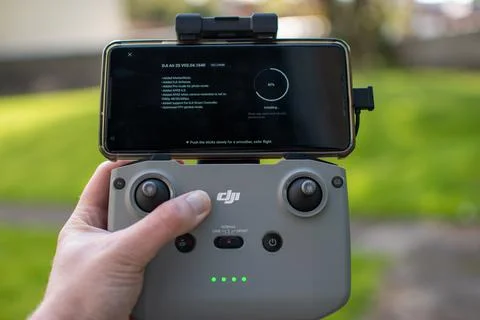 Close-up of a DJI drone remote installing a software update 写真素材