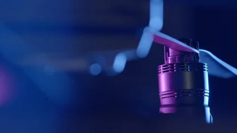 Close-up of DJI Inspire 2 drone rotor in purple lighting with zoom lense Stock Footage 129288831