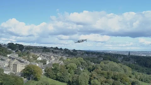 Close up DJI Mavic Pro 2 drone descending over viaduct Stock-Footage 103682461