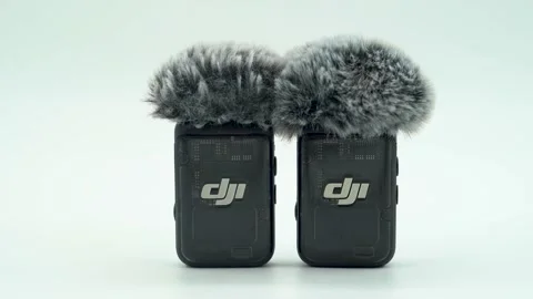 Close up of DJI wireless microphone with furry windscreen on white background. Stock Footage 331694317