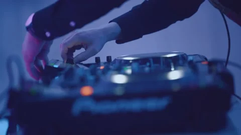 Close-up of the DJ's hands at the console Stock Footage 225876515