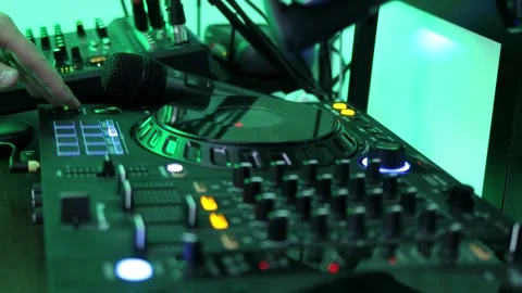 Close-up of the DJ's hands press different buttons on the DJ remote control Stock Footage 263212695