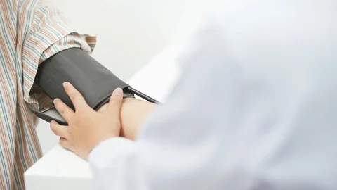 Close up a doctor checking blood pressure of senior patient Stock Footage 130130564