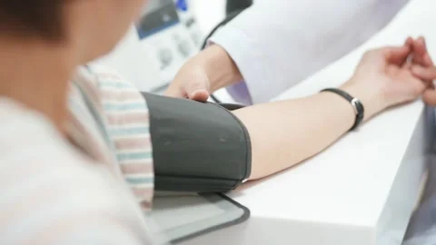 Close up a doctor checking blood pressure of senior Stock Footage 130812849