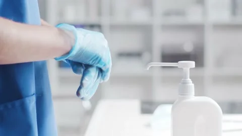 Close-up of doctor cleaning hands using disinfectant with medical soap. Office Stock Footage 140971628