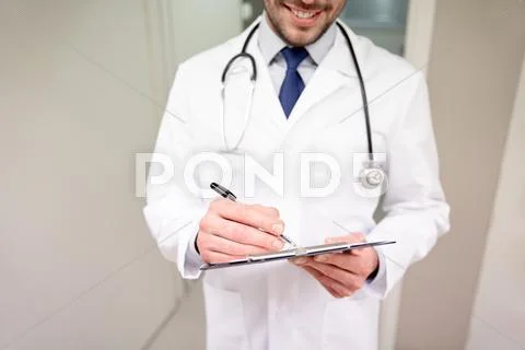 Close up of doctor with clipboard at hospital Stock Photos