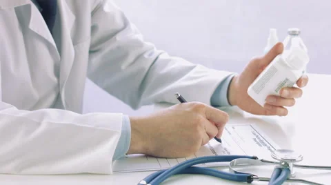Close Up Doctor hand writing rx prescription Stock Footage 56459651