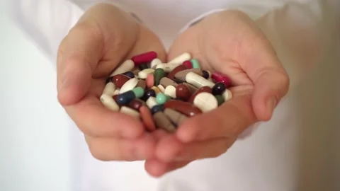 Close up of doctor hands displaying medication Stock Footage 150379898