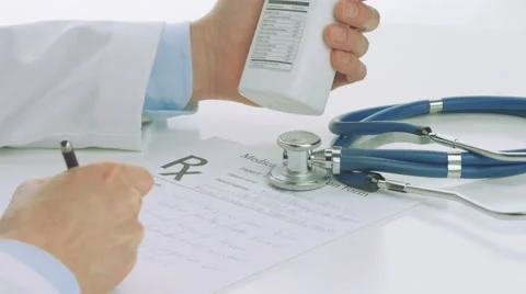 Close Up Doctor hands with medication writing  rescription Stock Footage 56455614