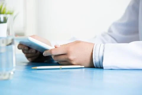 Close up of doctor hands with tablet computer Stock Photos