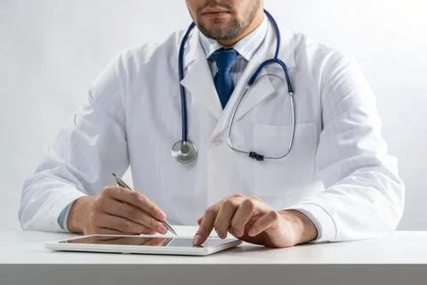 Close up of doctor hands using tablet computer Stock Photos