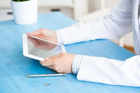 Close up of doctor hands using tablet computer Stock Photos