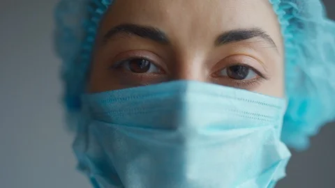 Close Up Doctor or nurse With Face Mask Preparing Surgery Intervention Stock Footage