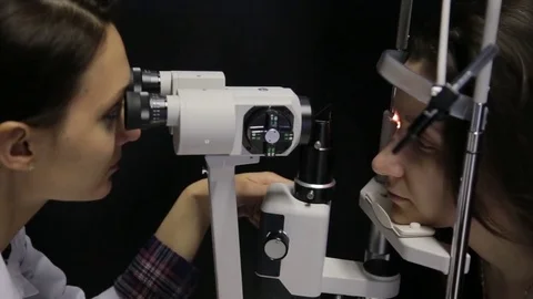 Close-up. The doctor performs a patient's vision study using the newest Stock Footage 79266148