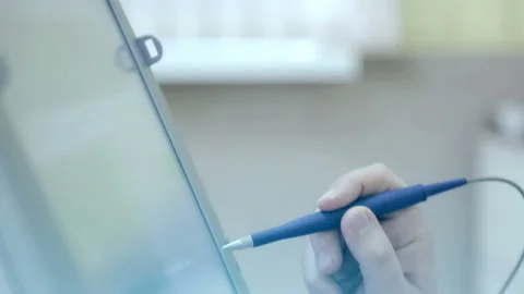 Close-up of a doctor stylus conducts a computer screen examining the heart of Stock Footage 88698343