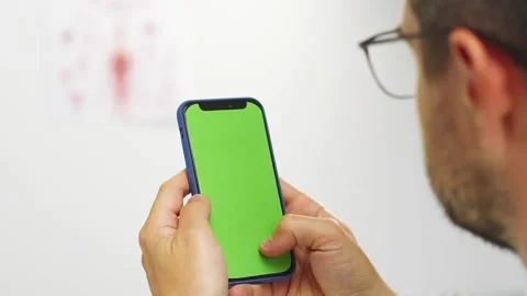 Close-up of doctor using chromakey phone Stock Footage 135913403