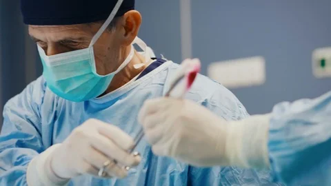 Close up of doctor using medical scissors Video stock 105350779