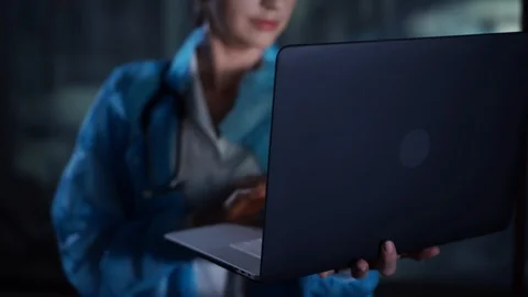Close up doctor working on laptop computer, typing, in the hospital, laboratory Stock Footage 95411396