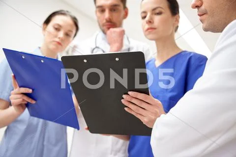 Close up of doctors with clipboard at hospital Stock Photos