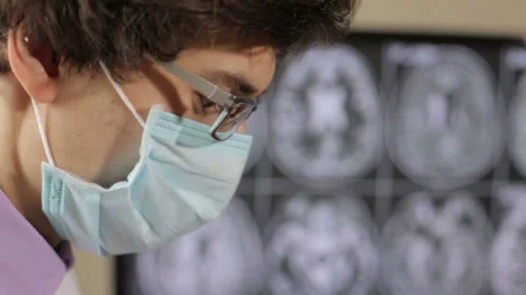 Close up of a doctor's face in a surgical operating room. Stock Footage 156069259