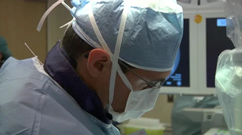 Close up of Doctor's Face While Operating (With Audio) Stock Footage 33986522