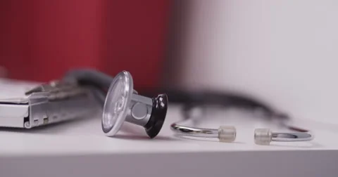 Close-up of doctor's hand writing on a clipboard Video stock 58232012