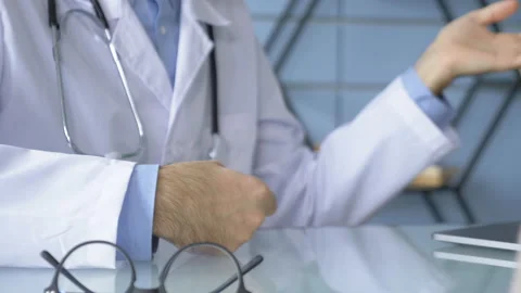 Close-Up Of The Doctor's Hands Explaining and Showing Something Stock Footage 147863262
