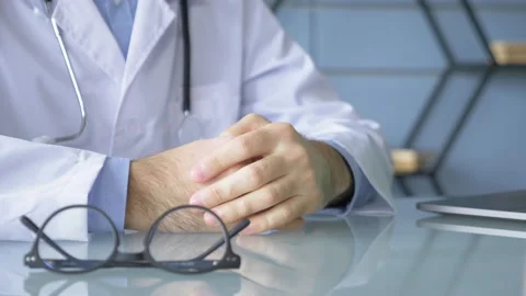 Close-Up Of The Doctor's Hands Explaining and Showing Something Stock Footage 147863277