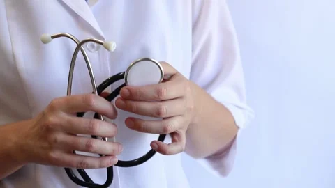 Close-up of a doctor's hands holding a stethoscope Stock Footage 317240903