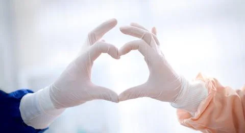 Close up of doctors hands  making heart shape Stock Photos