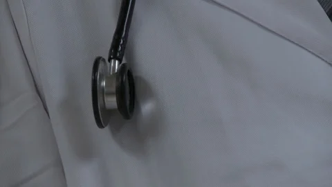 Close up of doctor's stethoscope with white lab coat, interior hospital. 스톡 동영상 111432148