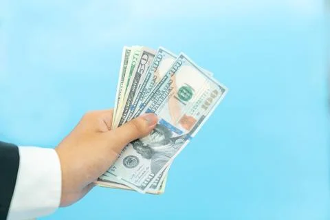 Close up dollar bills in hand. Stock Photos