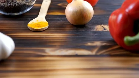 Close up dolly focus tracking footage of sweet pepper, garlic, curry powder and Stock Footage 84097349
