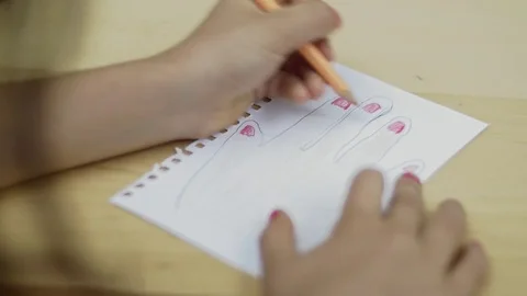Close up dolly of hands drawing Stock Footage 78753393