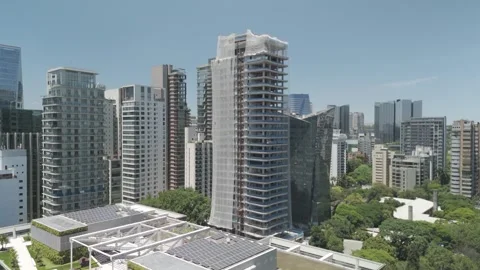 Close-Up Dolly-In of High-Rise Skyscraper Under Construction Stock Footage 322080676
