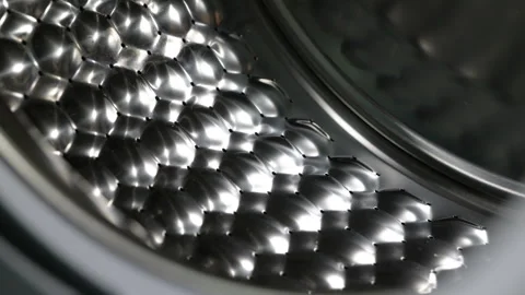 Close-up dolly out from inside washing machine drum Stock Footage 344743083