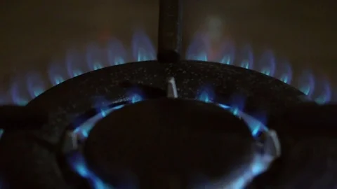Close up dolly shot of a cooker being ignited Stock Footage 83390248
