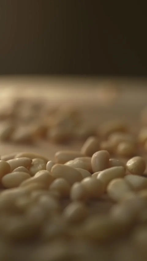 Close up dolly shot of pine nuts on a wooden board Stock Footage 333398508