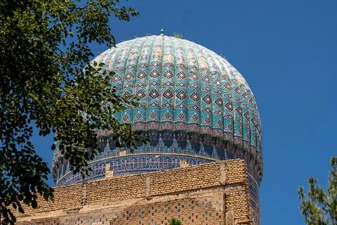 Close up on the dome of Bibi-Khanym Mosque in Samarkand, Uzbekistan. Blue s.. Stock Photos