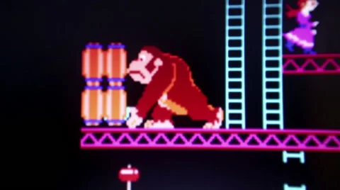 Close up of 'Donkey Kong' with primary gorilla antogonist rolling barrels to Stock Footage