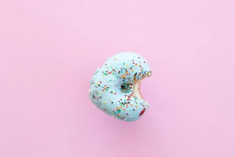 Close up donut with bite missing isolated on white background Stock Photos