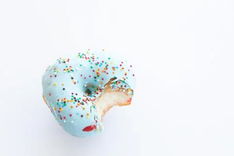 Close up donut with bite missing isolated on white background Foto stock