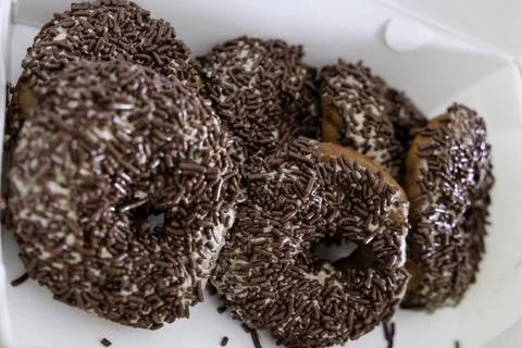 Close-up of donut with chocolate sprinkle. Stock Photos